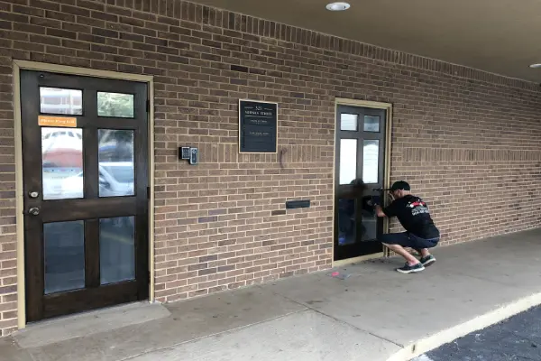 A person taking a picture of the door way.